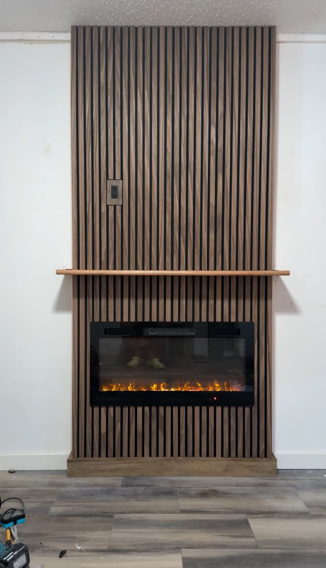 Modern slat wall fireplace feature with electric insert